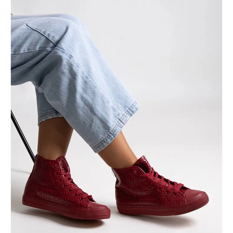 Red high-top openwork sneakers by Madala