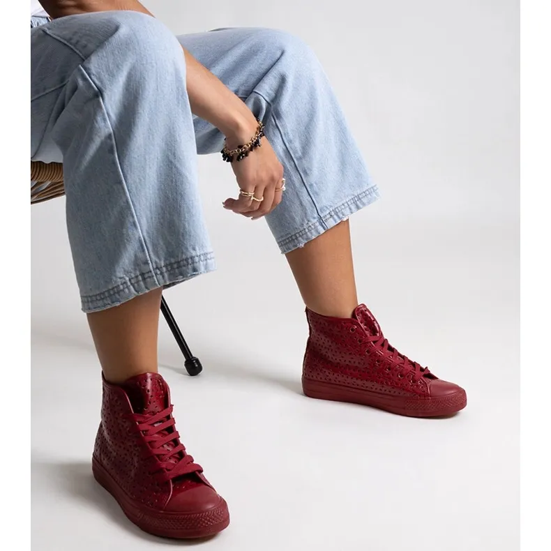 Red high-top openwork sneakers by Madala